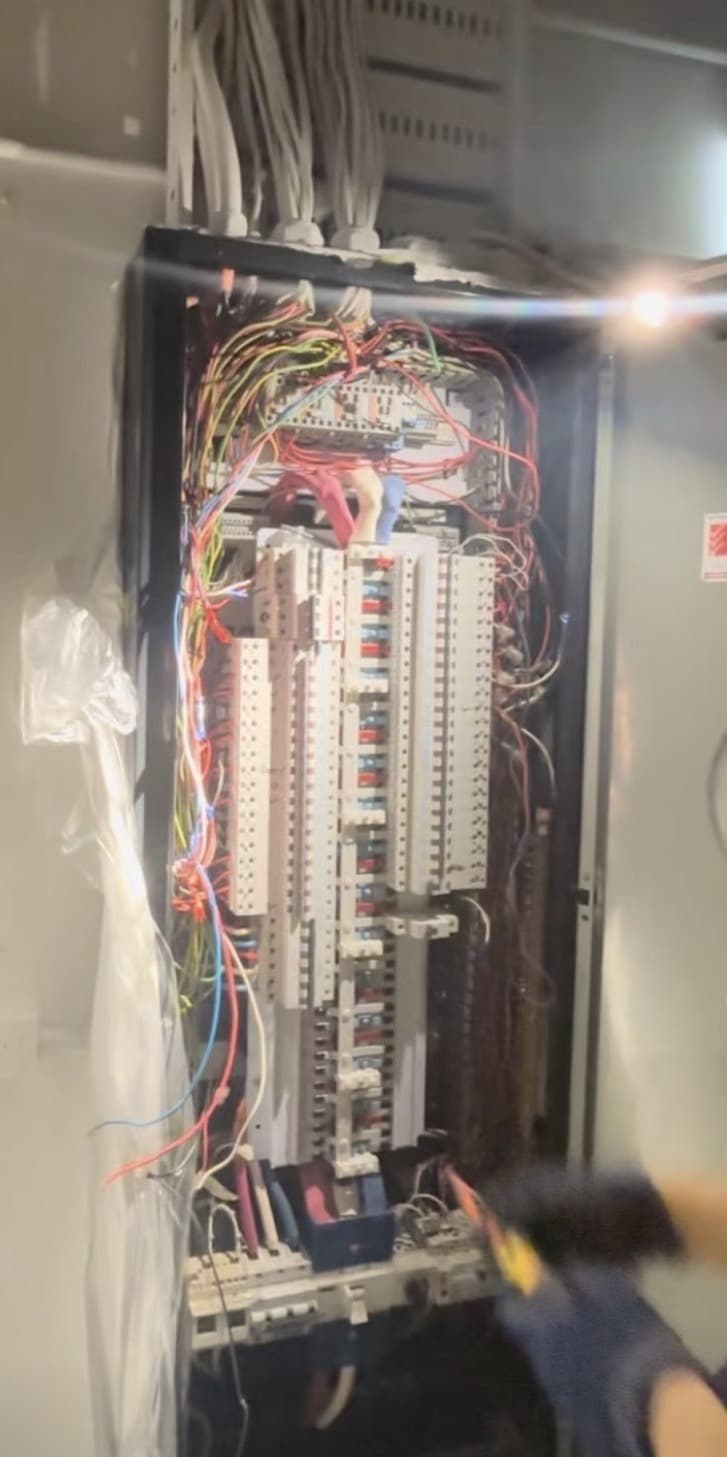 Three-phase circuit breaker installation in electrical cabinet